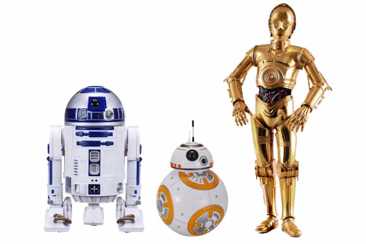 Star Wars drones in a line to celebrate May 4th: blue and white R2D2, orange and white BB8, and gold metal humanoid C3PO