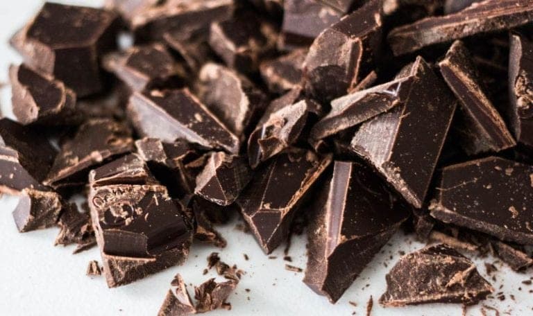 Aerial view of chocolate cut into pieces, one of the better Halloween treats